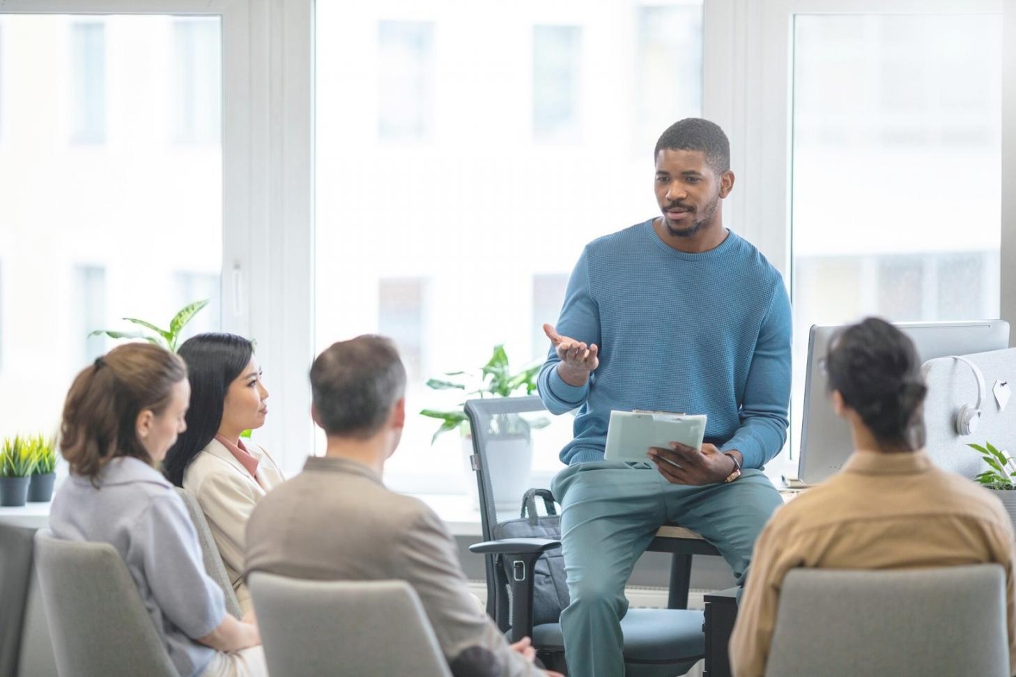 Interactive workshop session with instructor demonstrating UAT coordination techniques to engaged students